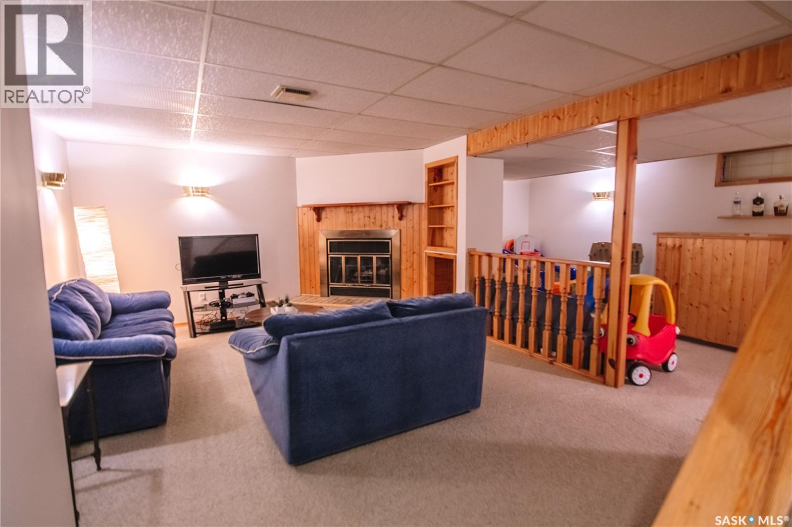 1222 Flexman Crescent N, Regina, SK - Indoor With Fireplace