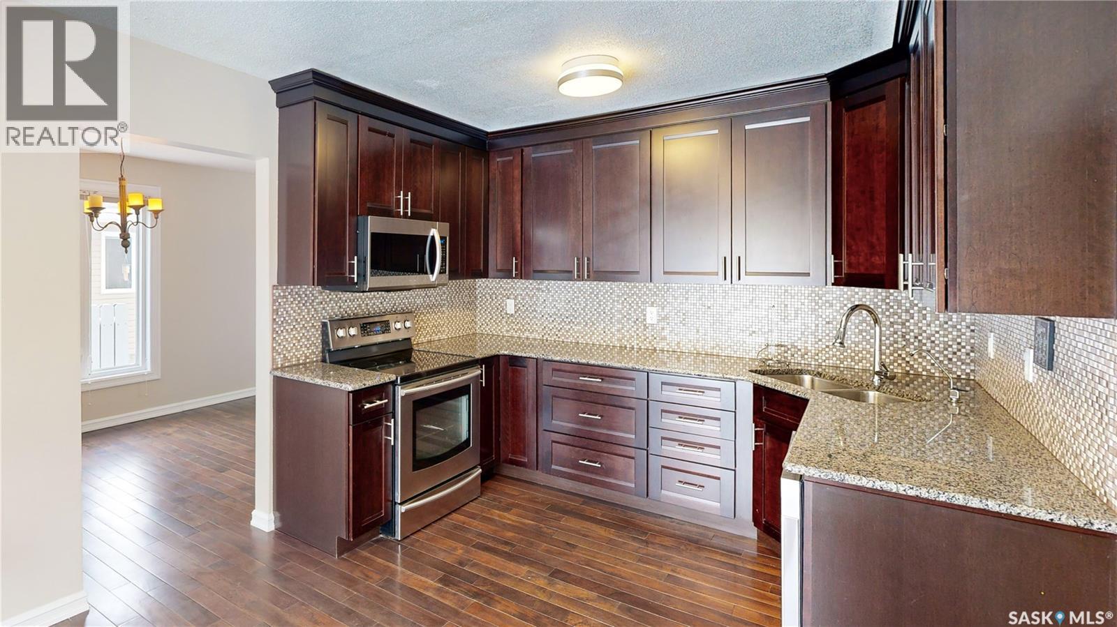 50 Lowry Place, Regina, SK - Indoor Photo Showing Kitchen With Double Sink With Upgraded Kitchen