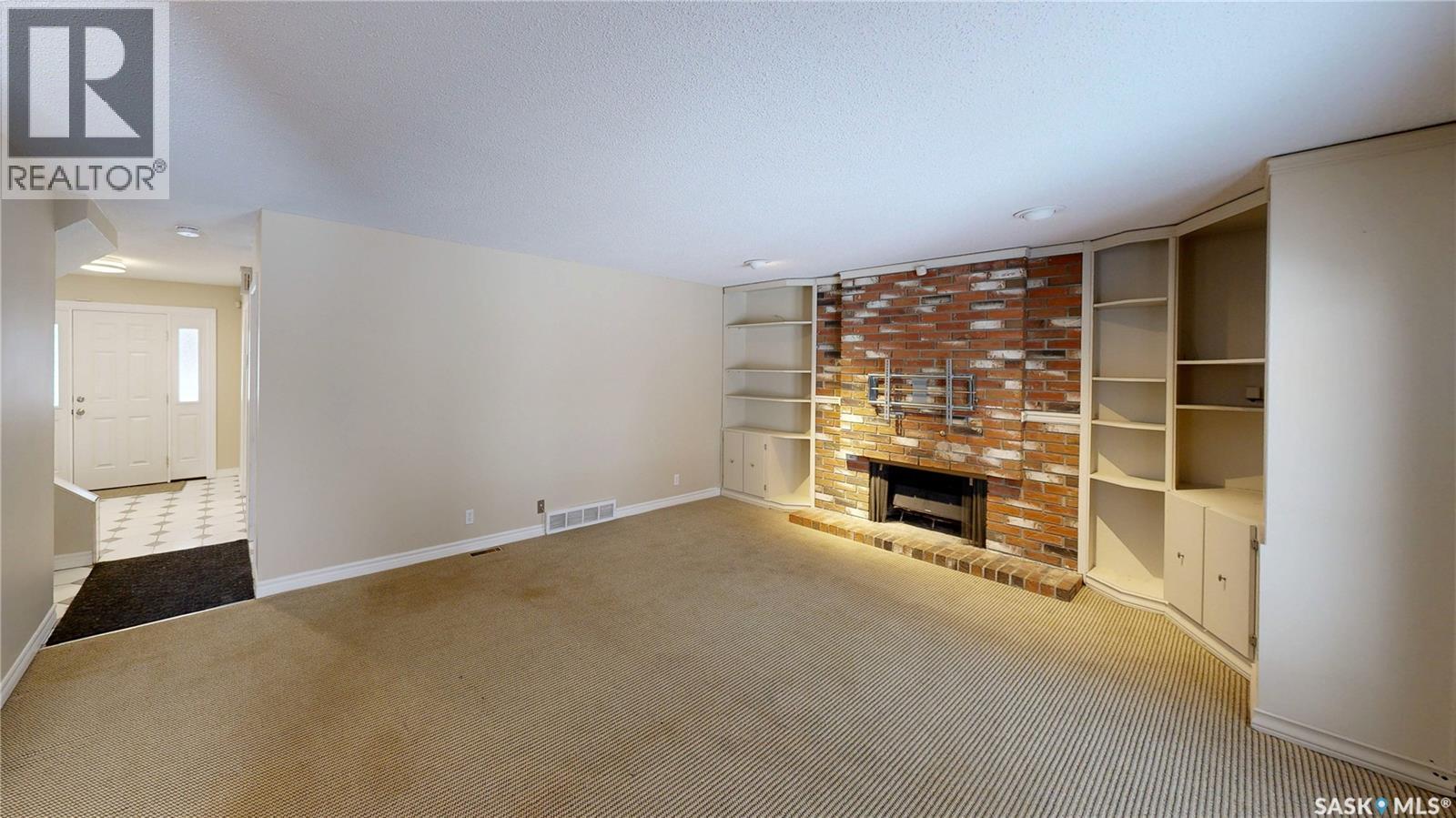 50 Lowry Place, Regina, SK - Indoor Photo Showing Other Room With Fireplace