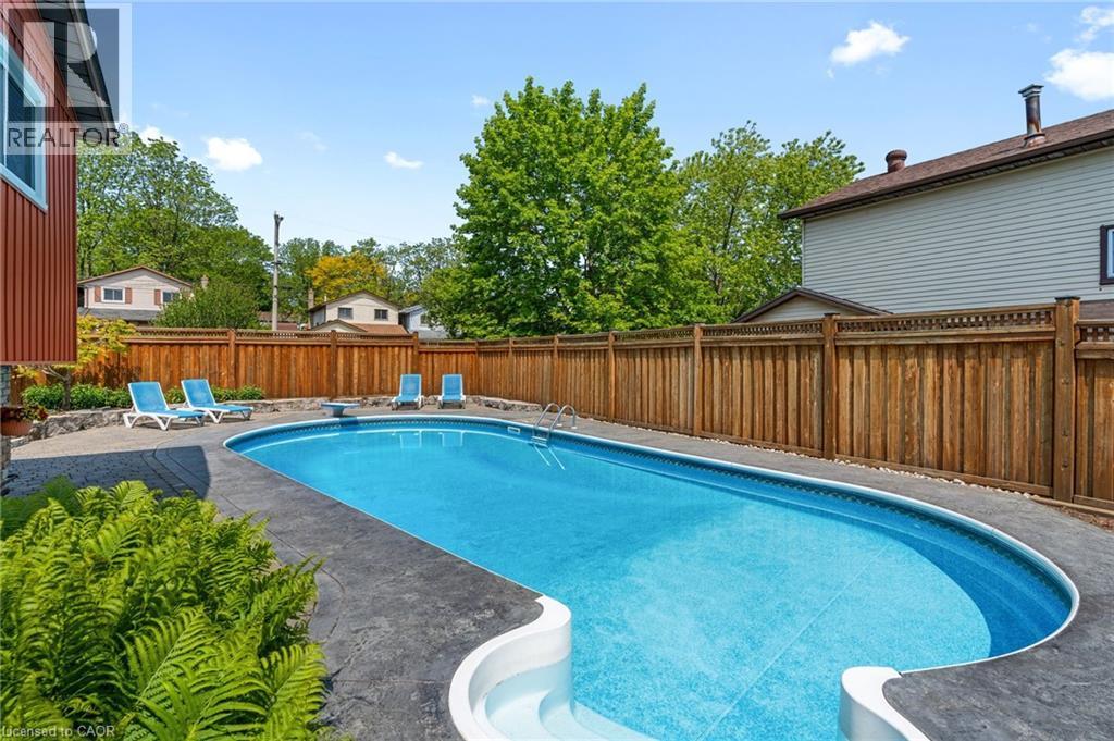 25 Burke Drive, Caledonia, ON - Outdoor With In Ground Pool With Deck Patio Veranda With Backyard