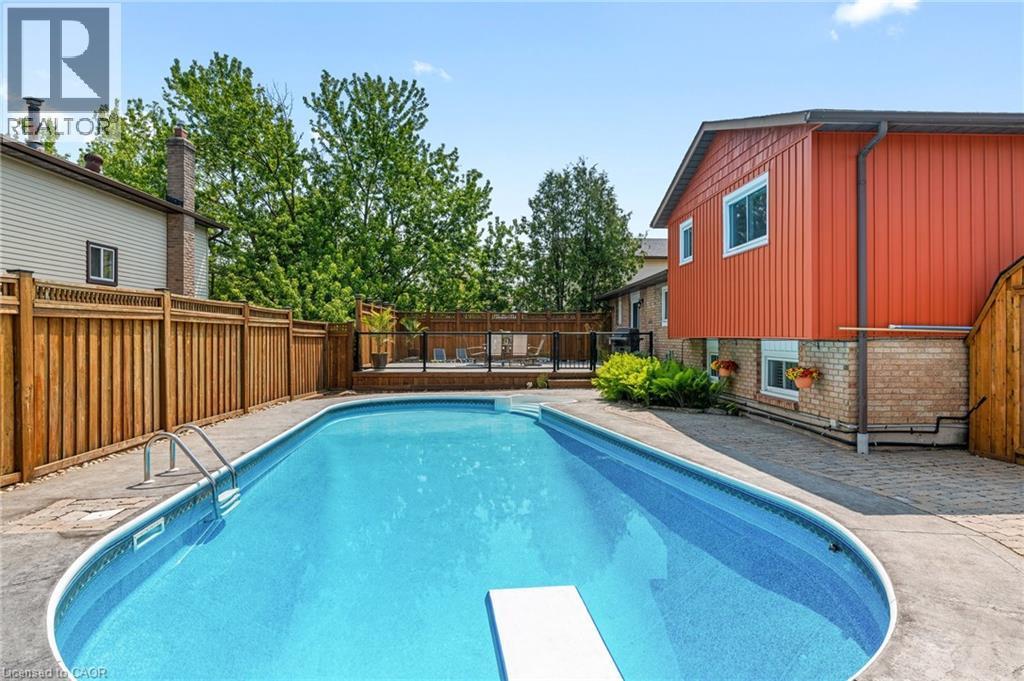 25 Burke Drive, Caledonia, ON - Outdoor With In Ground Pool With Backyard With Exterior