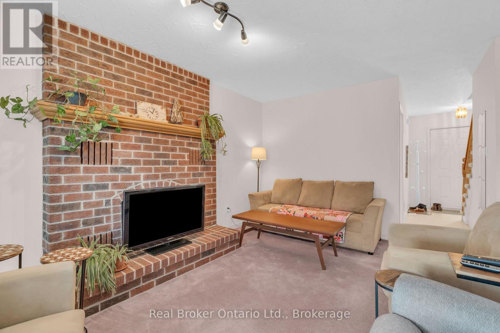 50 South Drive, Kitchener, ON - Indoor Photo Showing Living Room With Fireplace