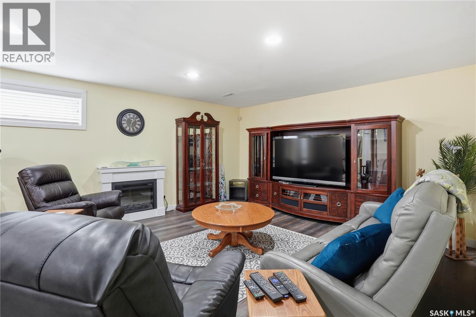 5053 Canuck Crescent, Regina, SK - Indoor Photo Showing Living Room With Fireplace