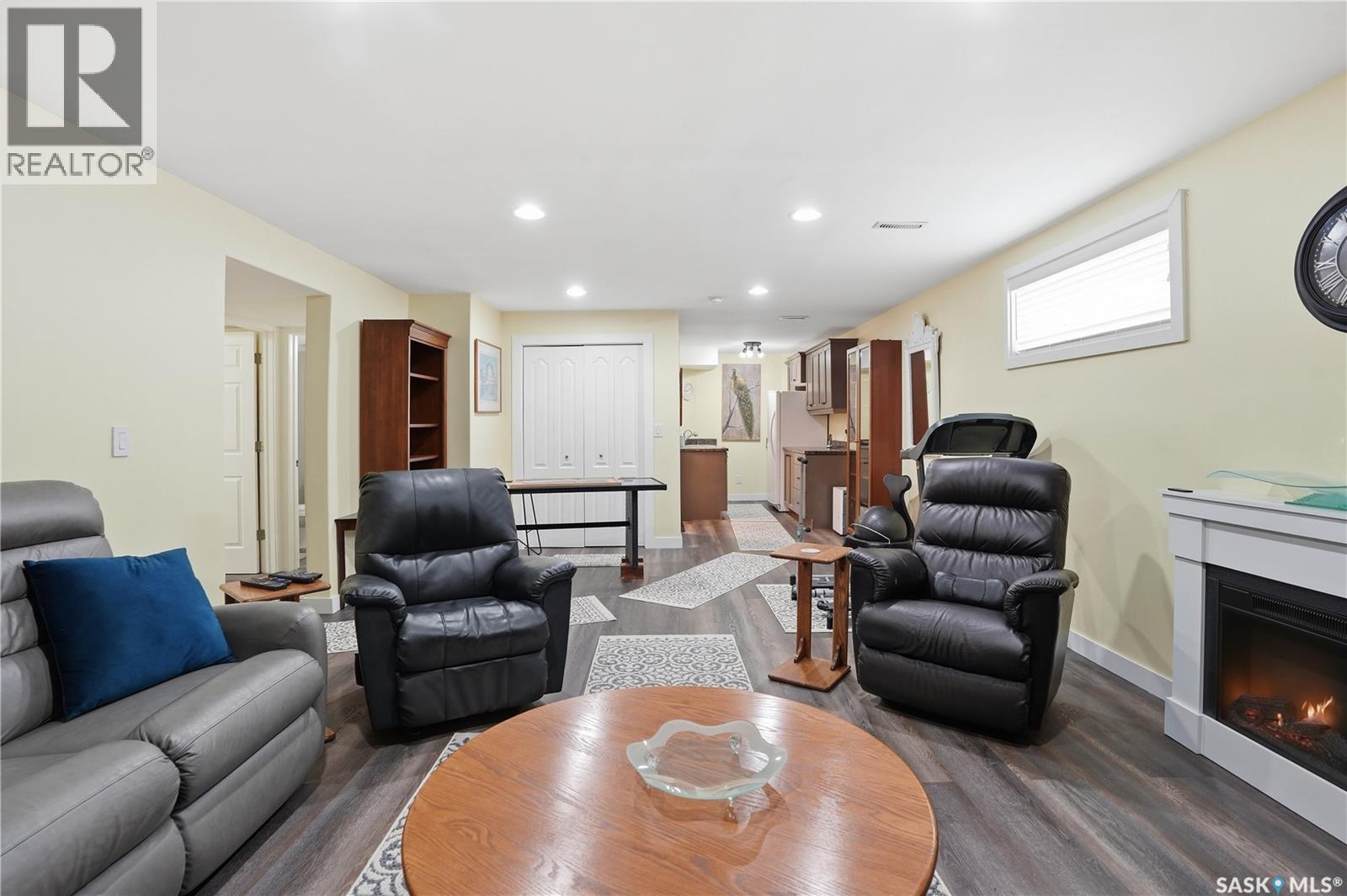 5053 Canuck Crescent, Regina, SK - Indoor Photo Showing Living Room With Fireplace
