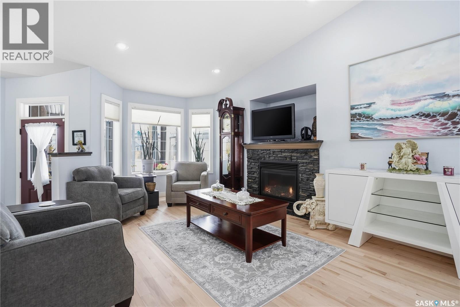 5053 Canuck Crescent, Regina, SK - Indoor Photo Showing Living Room With Fireplace