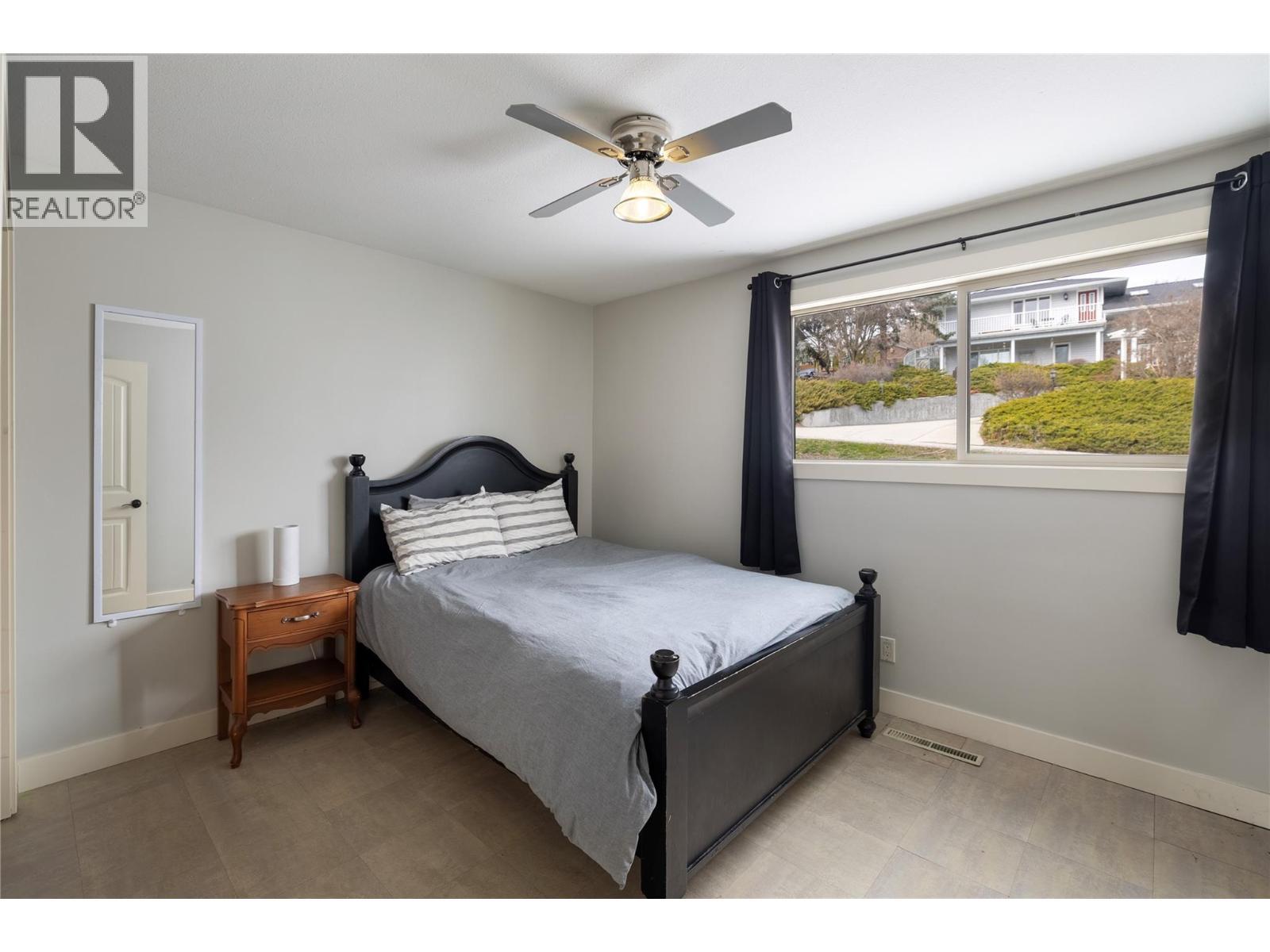 Bedroom 1 - 8705 Kalview Drive, Coldstream, BC - Indoor Photo Showing Bedroom