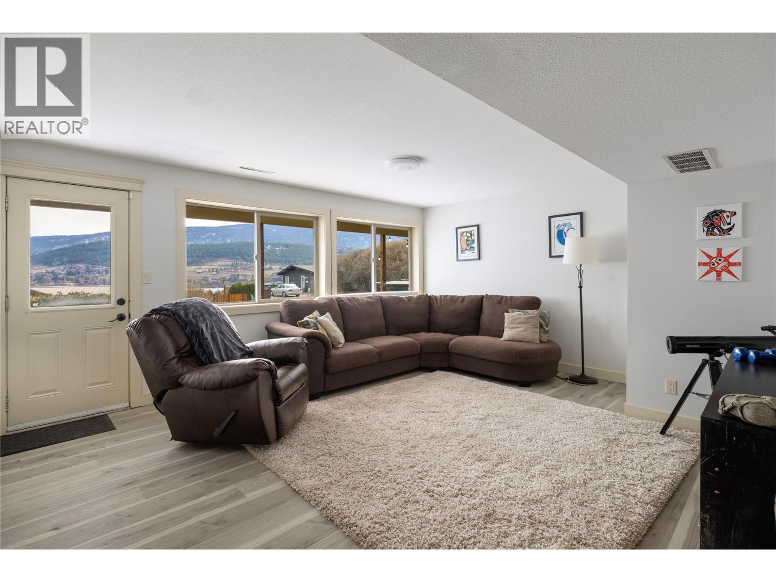 Lower family room - 8705 Kalview Drive, Coldstream, BC - Indoor Photo Showing Living Room
