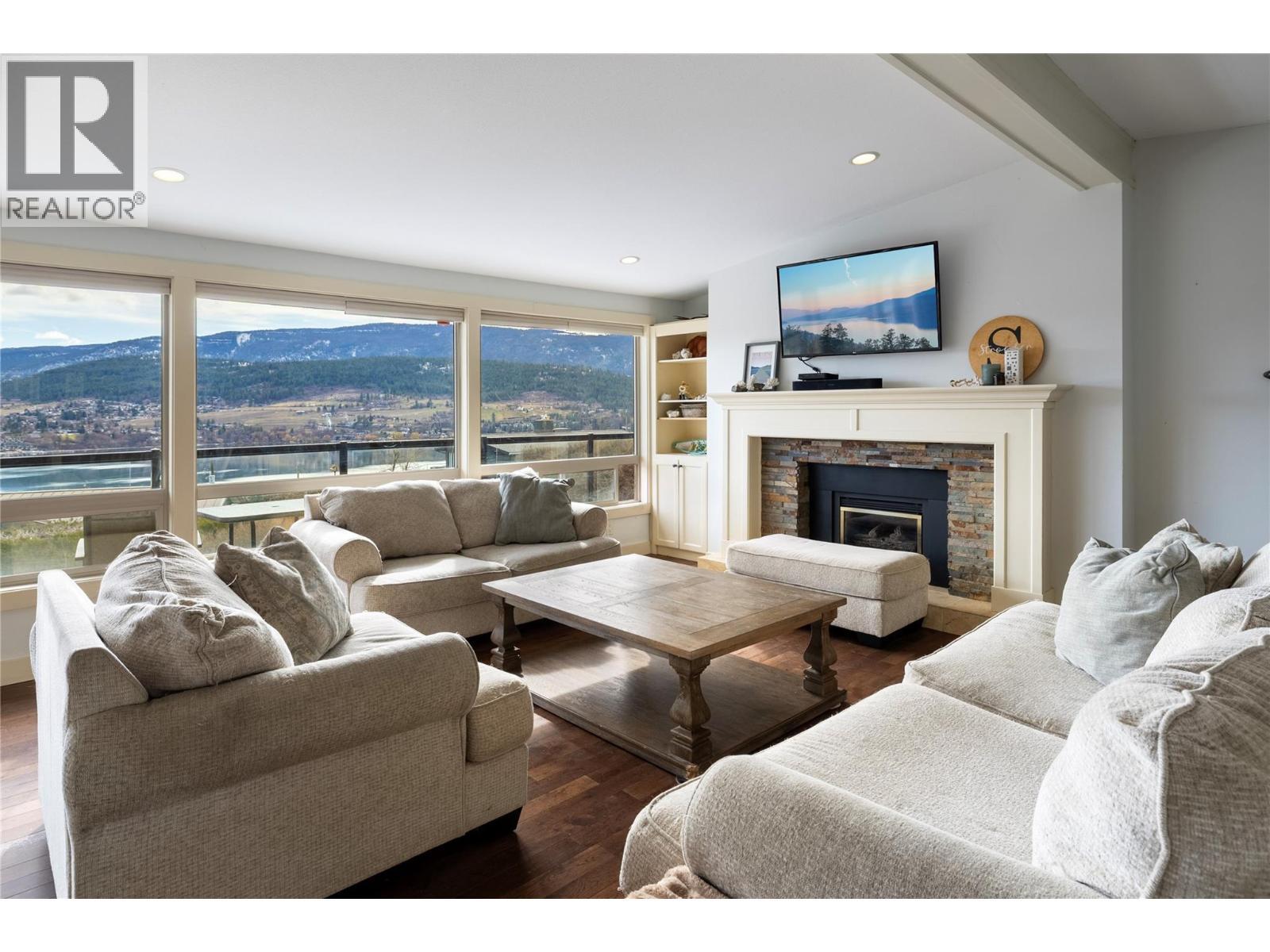 8705 Kalview Drive, Coldstream, BC - Indoor Photo Showing Living Room With Fireplace