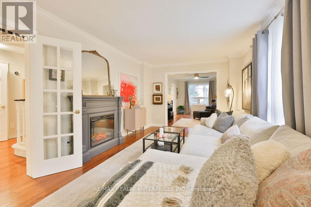 Living Room Open To Office/Den, Hardwood Floors - 431 Naomi Crescent, Mississauga, ON - Indoor Photo Showing Living Room With Fireplace