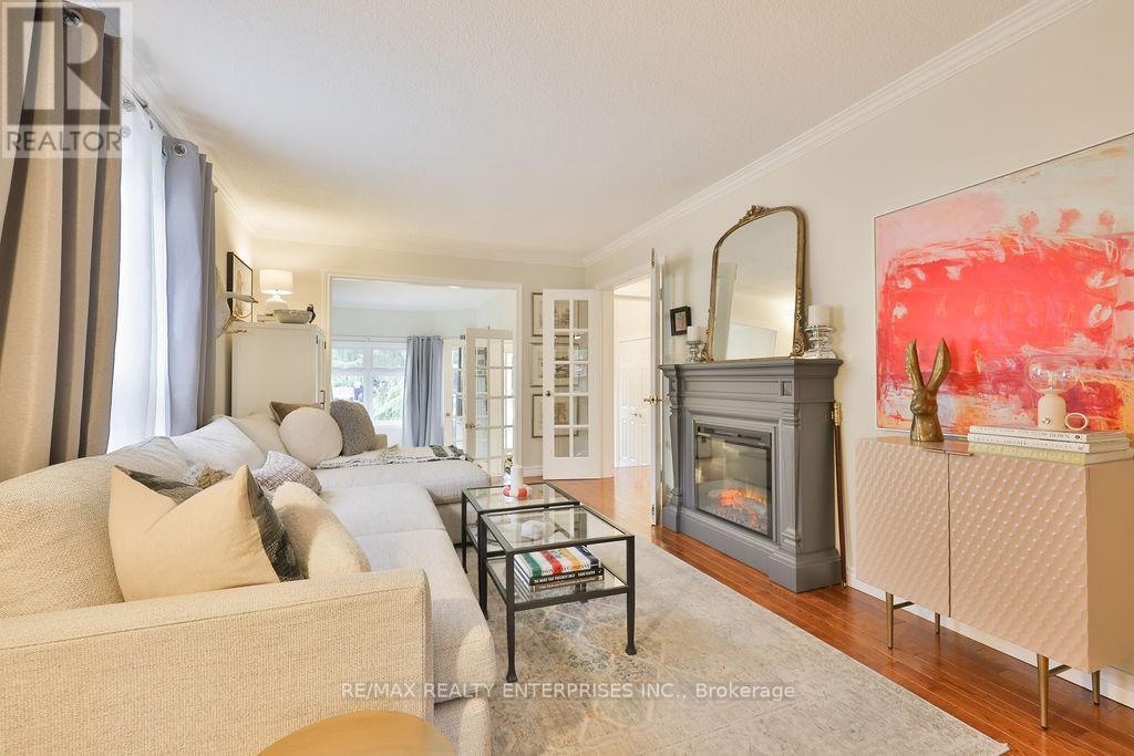 Crown Moulding, Open To Dining/Sitting Room - 431 Naomi Crescent, Mississauga, ON - Indoor Photo Showing Living Room With Fireplace