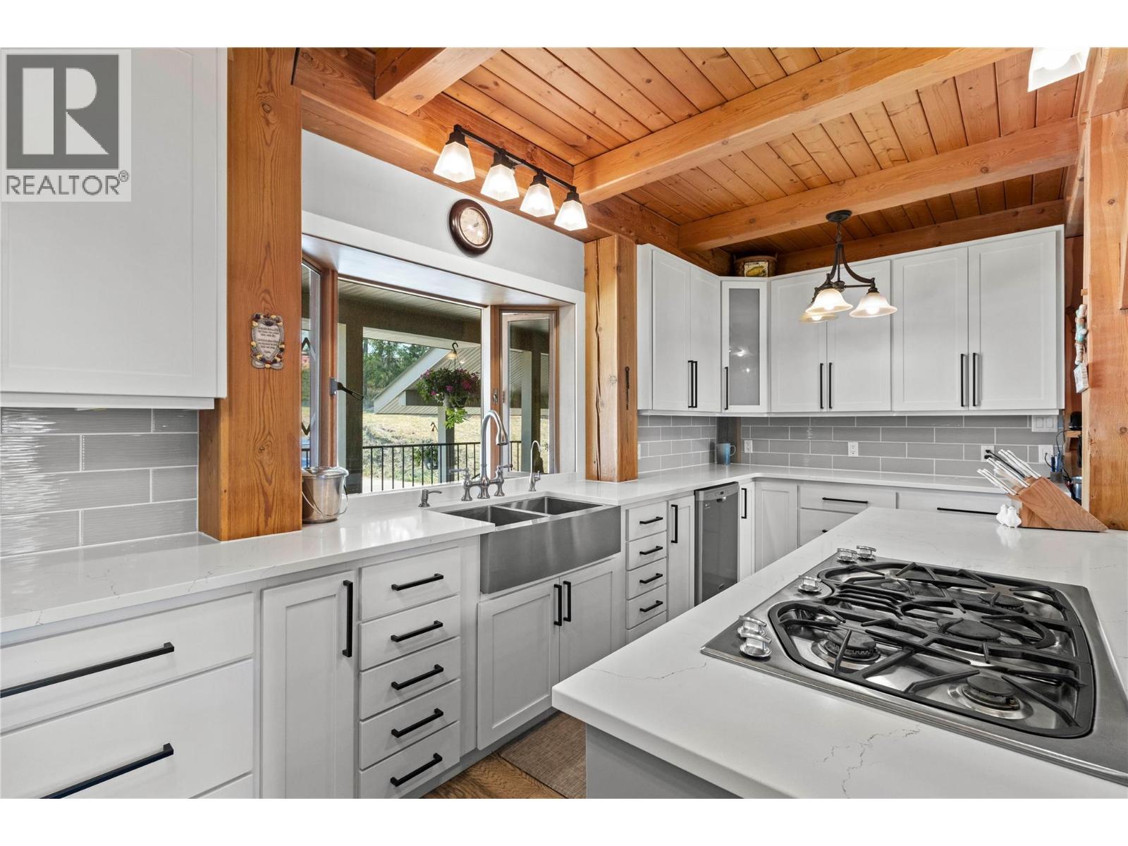 Farmhouse sink with bay window view - 1403 Notch Hill Road, Sorrento, BC - Indoor Photo Showing Kitchen With Double Sink