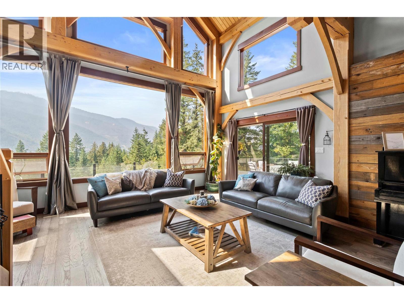 8 foot wide sliding doors from Living Room to wrap around deck - 1403 Notch Hill Road, Sorrento, BC - Indoor Photo Showing Living Room