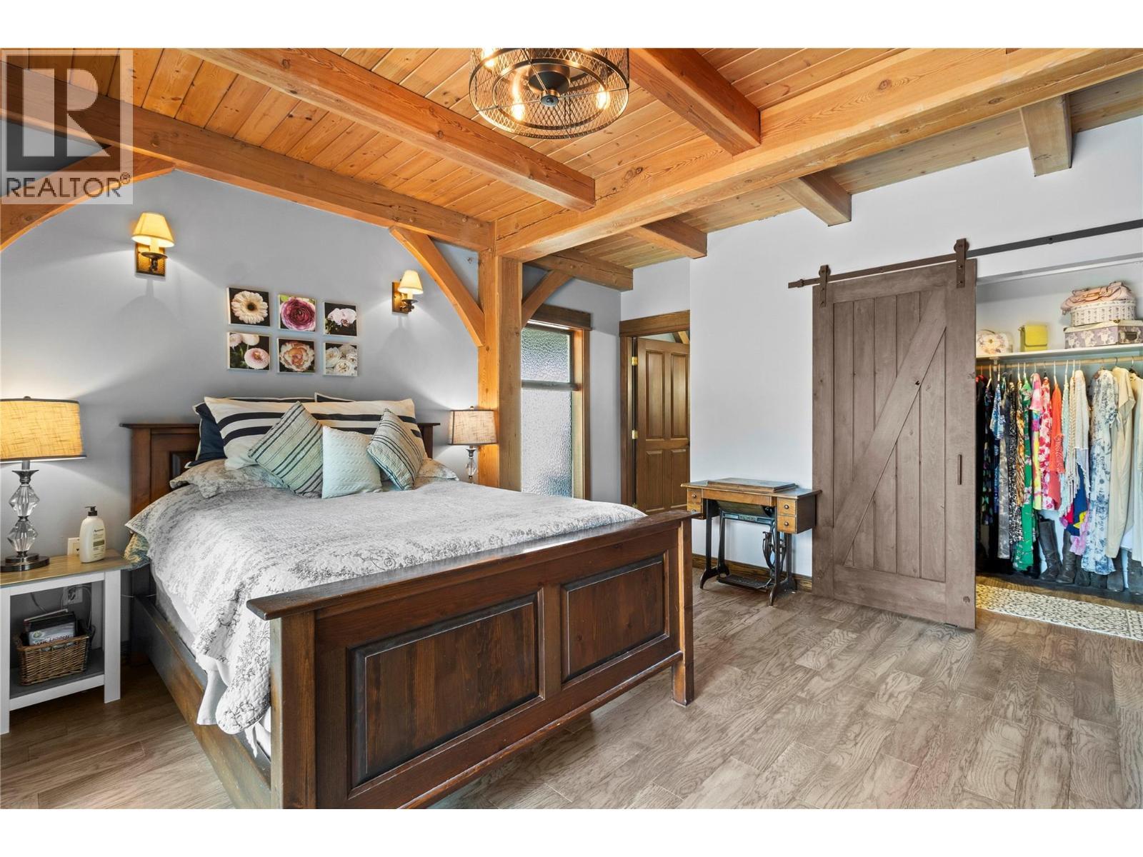 Primary Bedroom has W/I closet & Ensuite - 1403 Notch Hill Road, Sorrento, BC - Indoor Photo Showing Bedroom