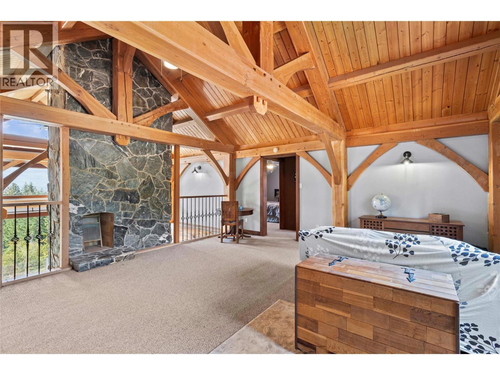 Loft Family Room looking to Bedroom - 1403 Notch Hill Road, Sorrento, BC - Indoor With Fireplace