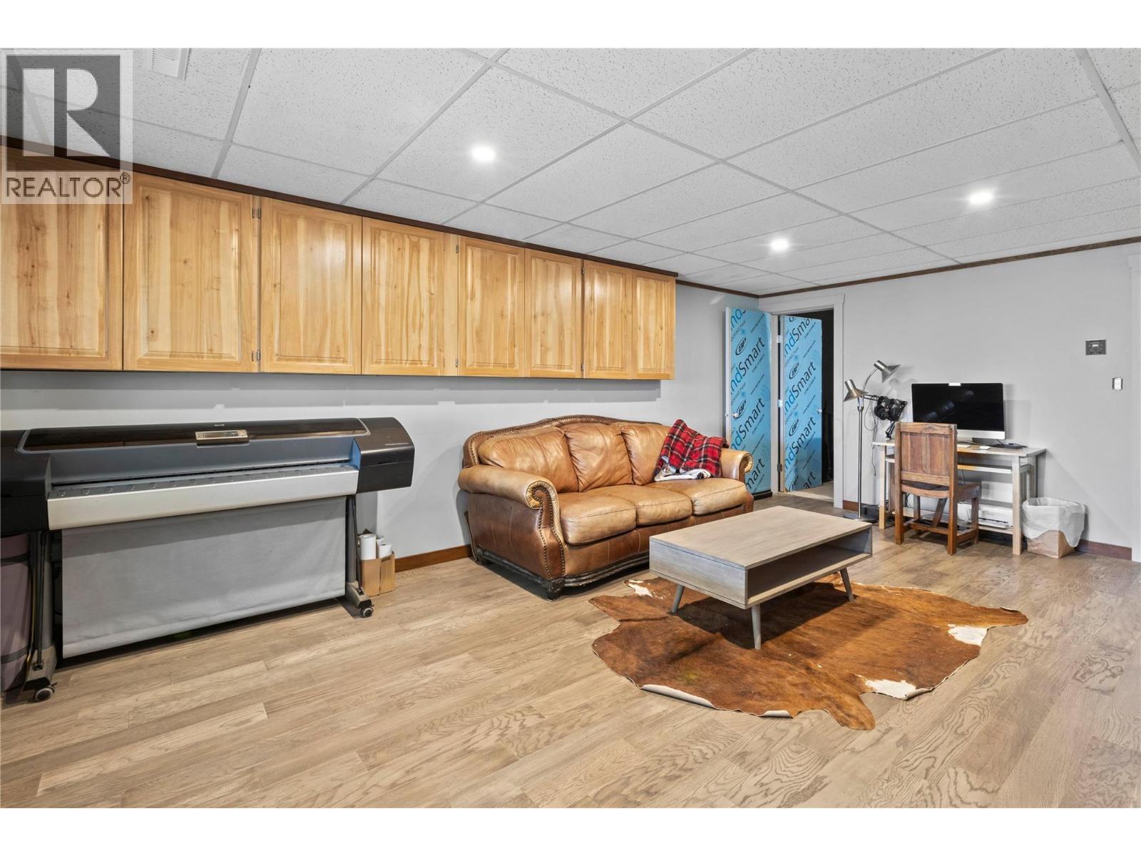 Lower Level Recreation Room showing door to studio - 1403 Notch Hill Road, Sorrento, BC - Indoor