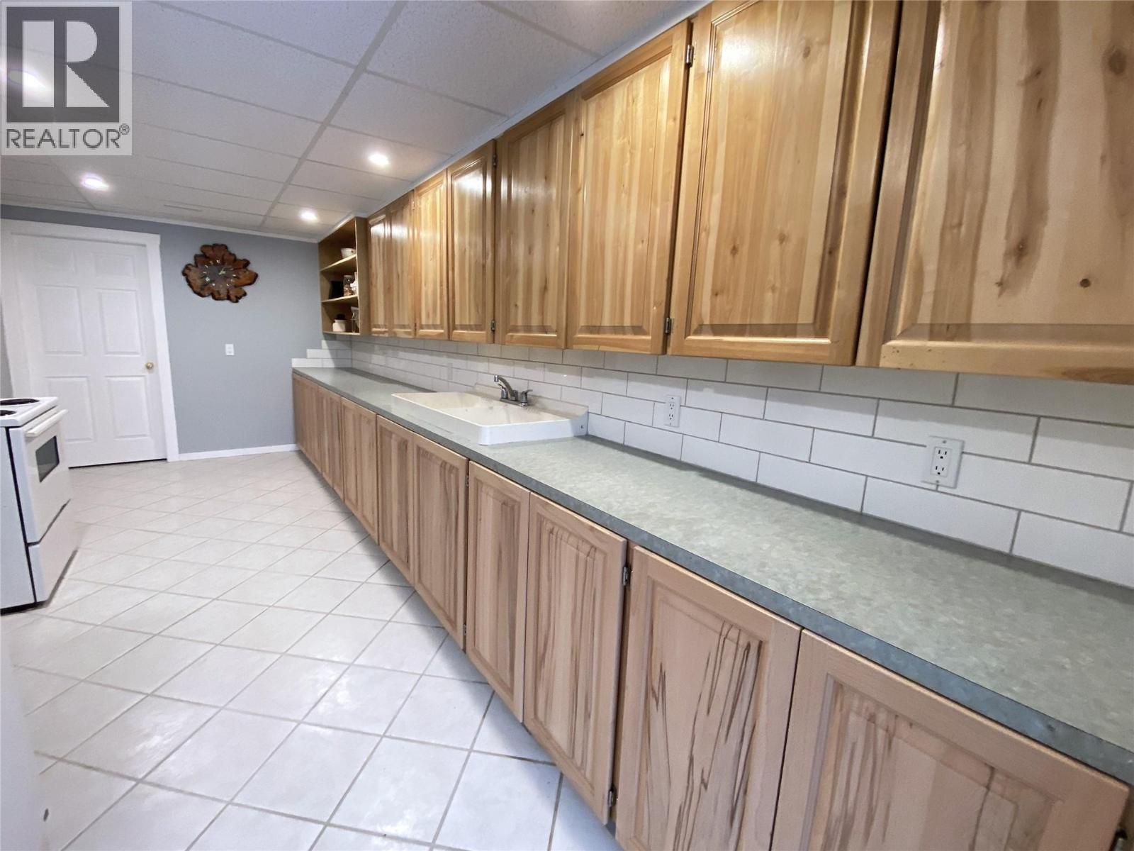 2nd Kitchen - reverse view. Door at end to 3 pc Bathroom - 1403 Notch Hill Road, Sorrento, BC - Indoor Photo Showing Kitchen