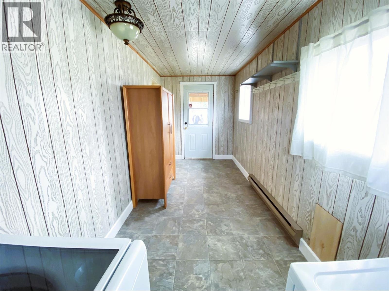 Laundry - reverse view looking to entrance - 1403 Notch Hill Road, Sorrento, BC - Indoor Photo Showing Other Room
