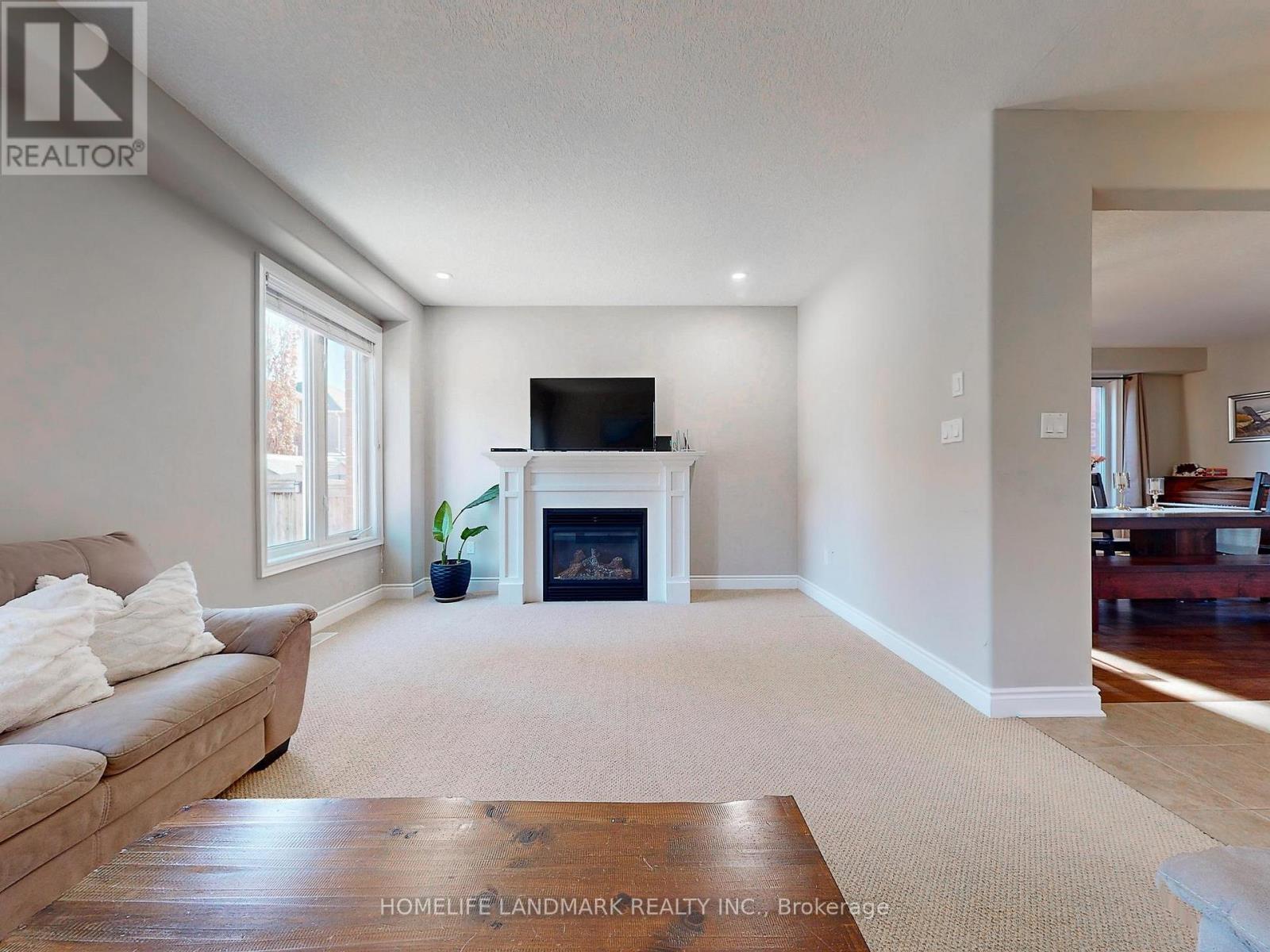 73 Graihawk Drive, Barrie, ON - Indoor Photo Showing Living Room With Fireplace