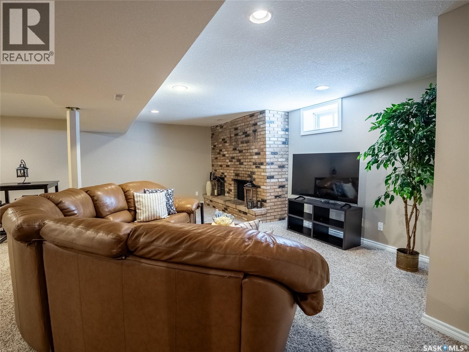 128 Mcdougall Crescent, Regina, SK - Indoor With Fireplace