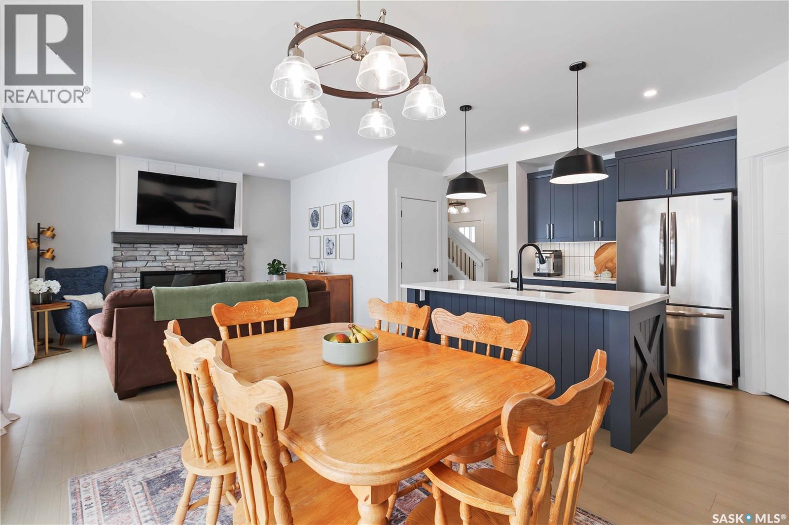 126 Chelsom Bend, Saskatoon, SK - Indoor Photo Showing Dining Room With Fireplace