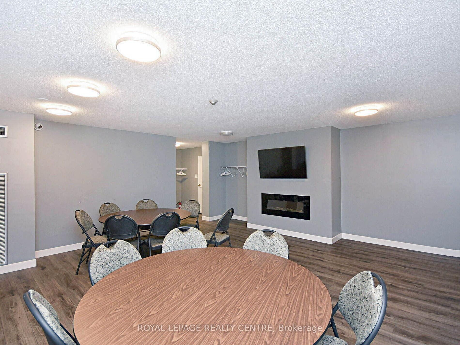 1604-3590 Kaneff Crescent W, Mississauga, ON - Indoor Photo Showing Dining Room With Fireplace