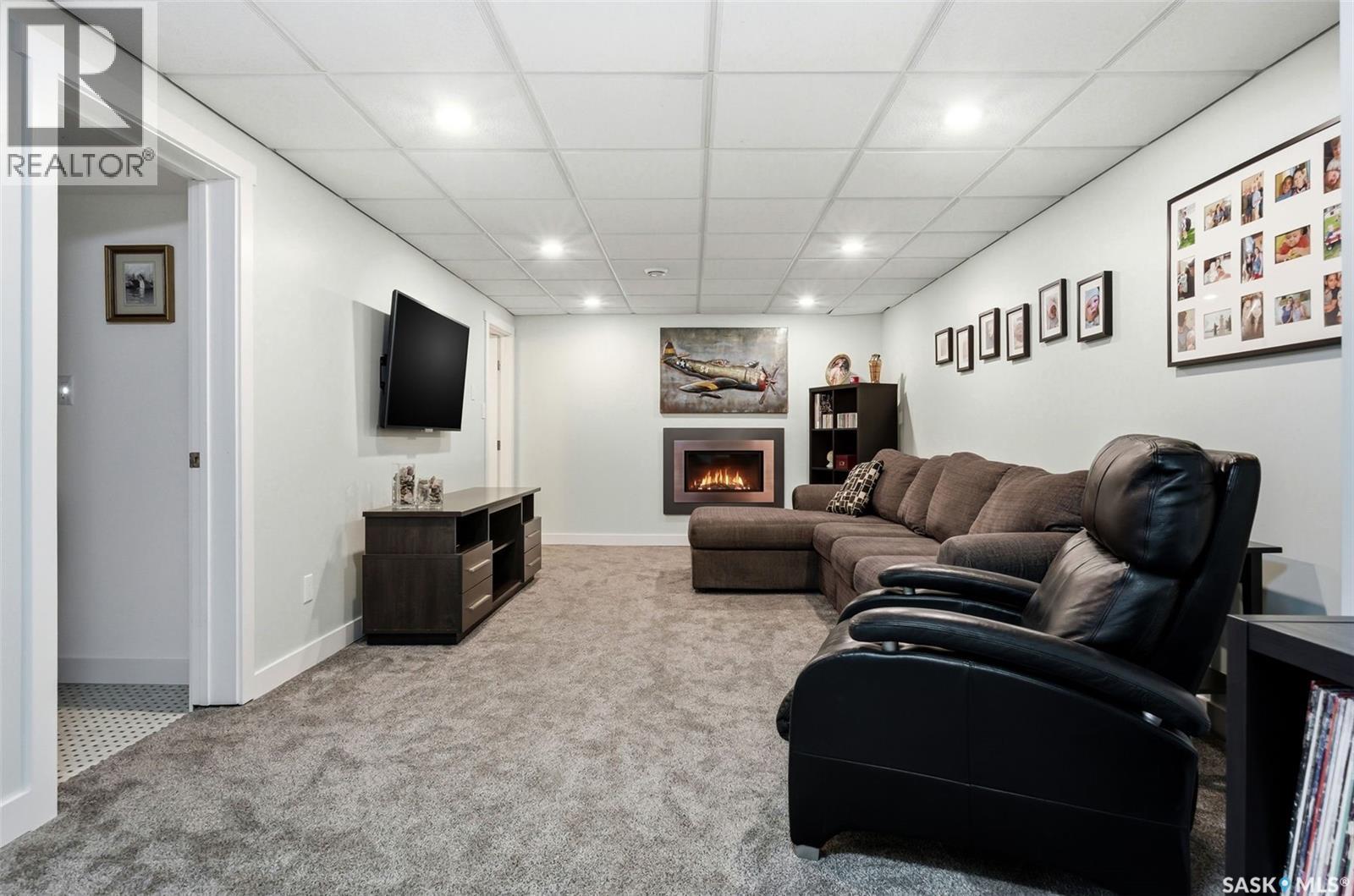 166 Deergrove Crescent, Regina, SK - Indoor With Fireplace