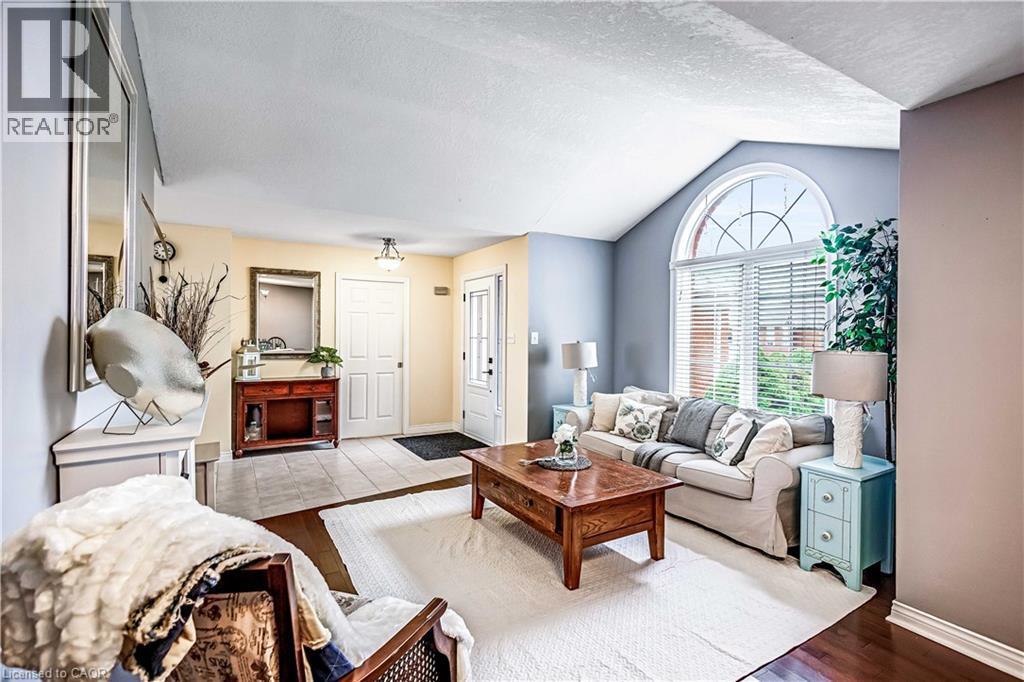 Living area featuring wood finished floors and baseboards - 65 Thistlemoor Drive, Caledonia, ON - Indoor Photo Showing Living Room