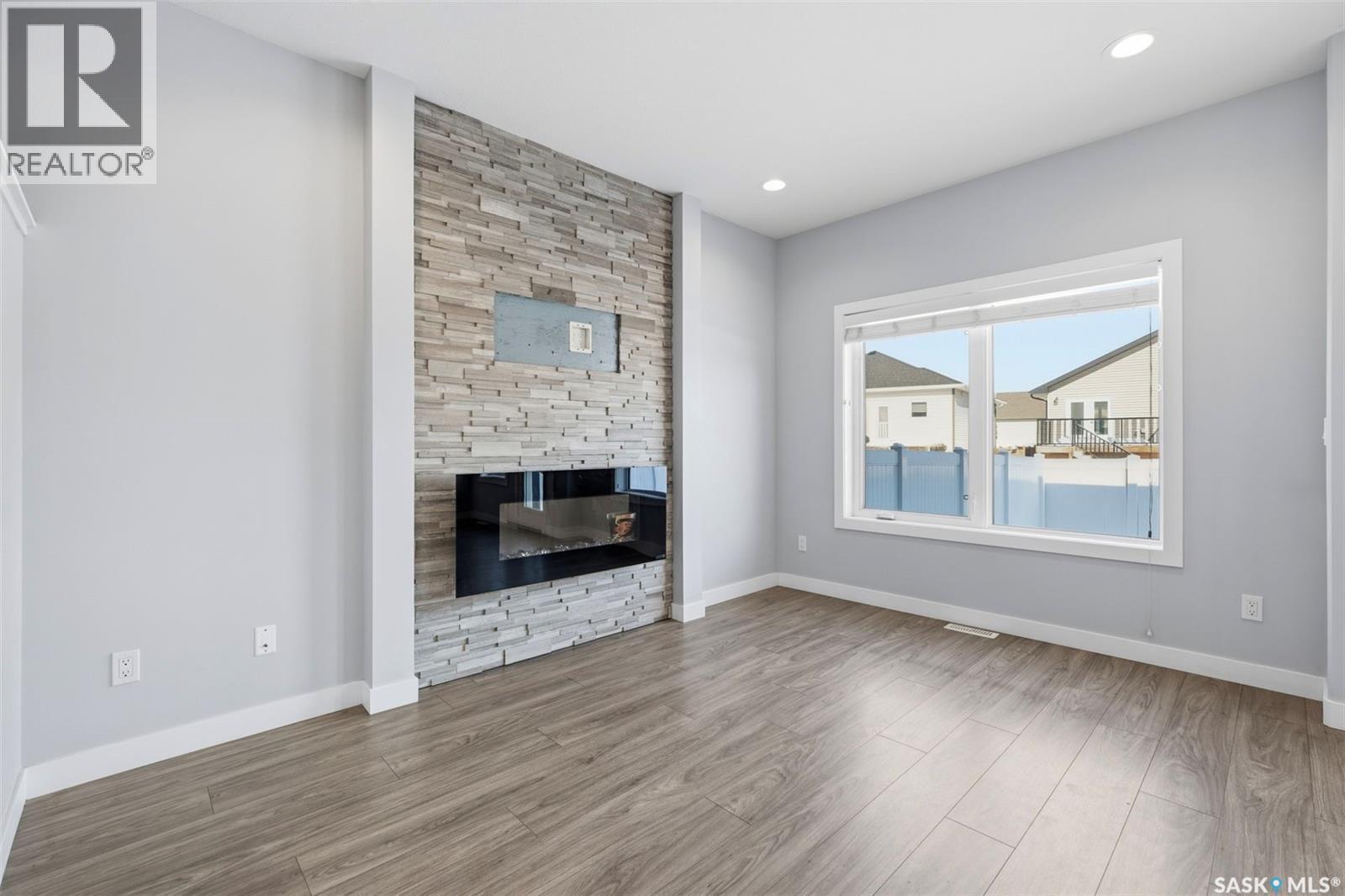 16 1003 Evergreen Boulevard, Saskatoon, SK - Indoor With Fireplace