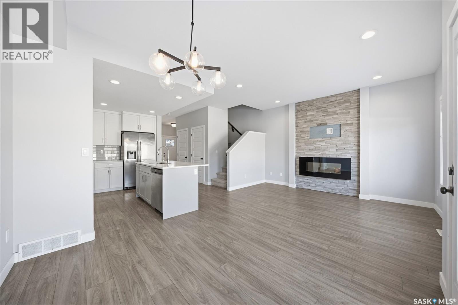 16 1003 Evergreen Boulevard, Saskatoon, SK - Indoor With Fireplace