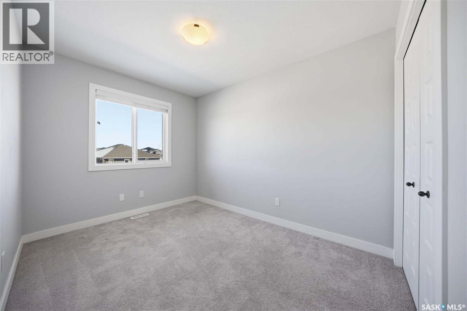 16 1003 Evergreen Boulevard, Saskatoon, SK - Indoor Photo Showing Other Room
