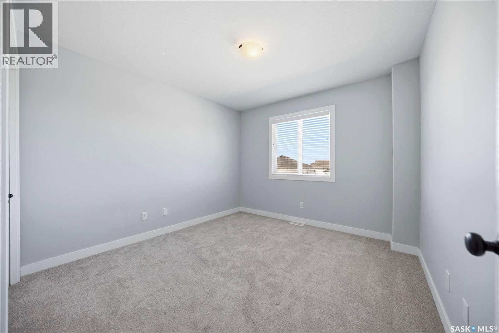 16 1003 Evergreen Boulevard, Saskatoon, SK - Indoor Photo Showing Other Room