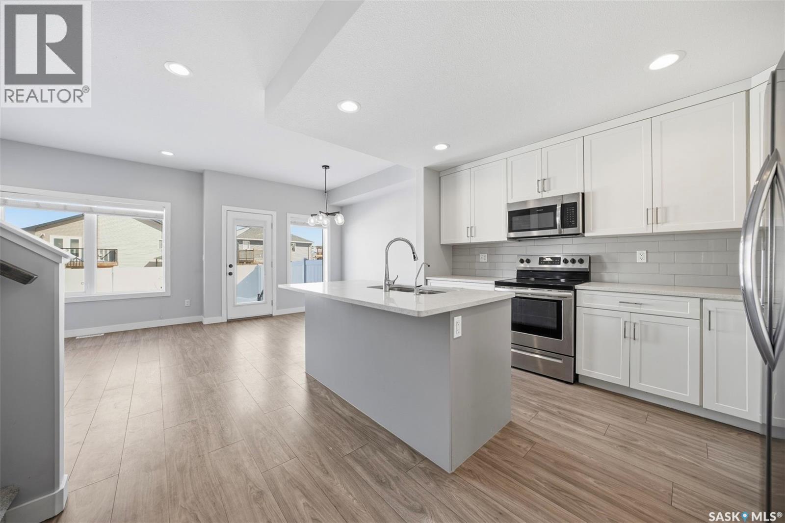 16 1003 Evergreen Boulevard, Saskatoon, SK - Indoor Photo Showing Kitchen With Upgraded Kitchen
