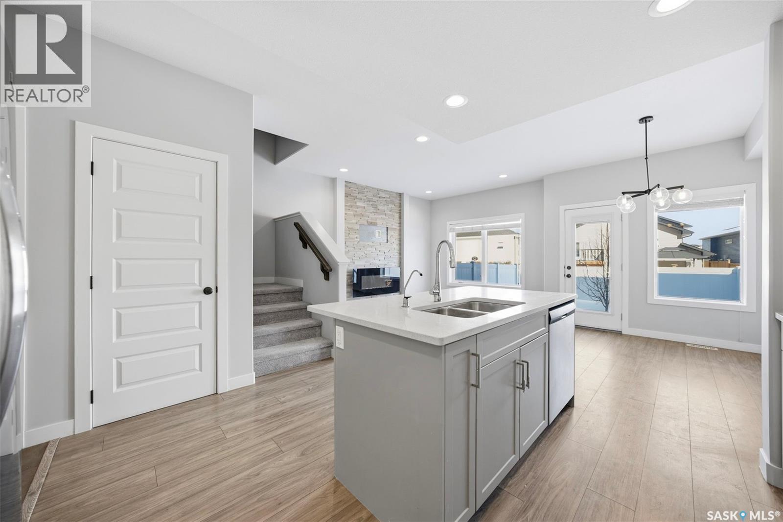 16 1003 Evergreen Boulevard, Saskatoon, SK - Indoor Photo Showing Kitchen With Double Sink