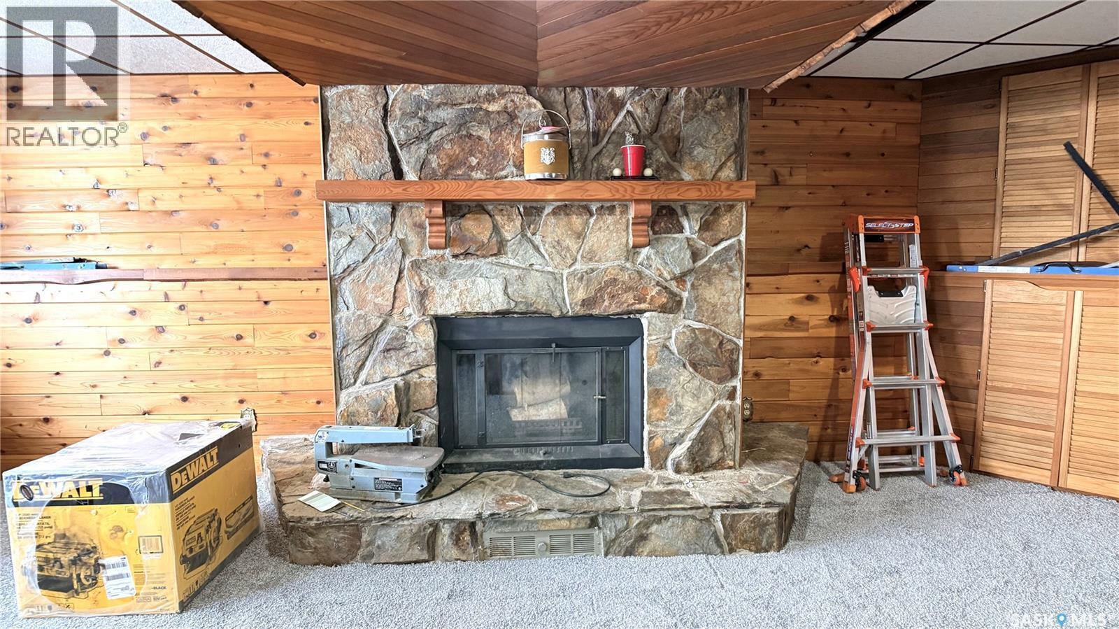 422 Spruce Drive, Estevan, SK - Indoor Photo Showing Living Room With Fireplace