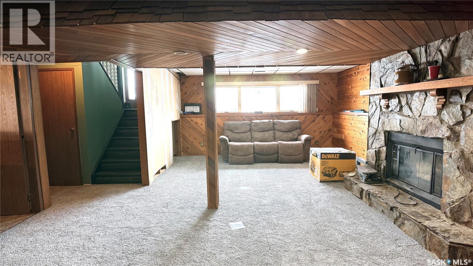 422 Spruce Drive, Estevan, SK - Indoor Photo Showing Other Room With Fireplace