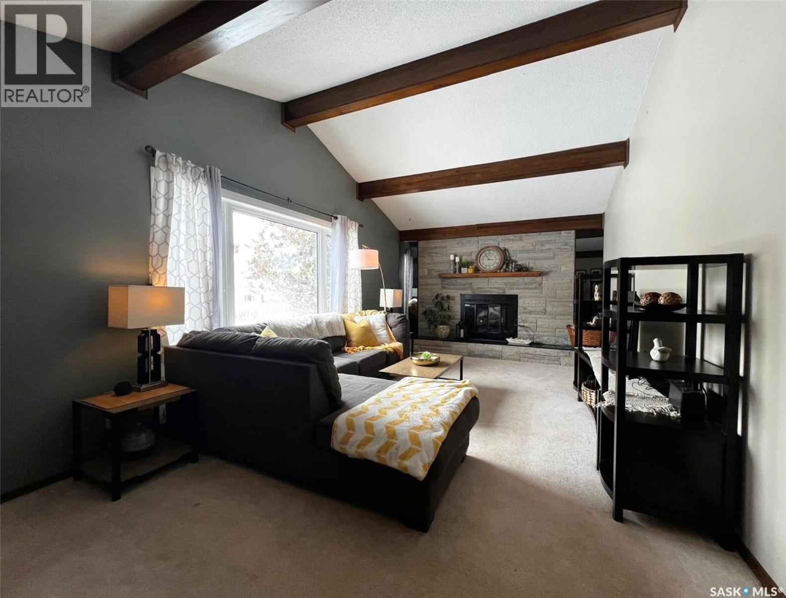 119 Macdonald Place, Swift Current, SK - Indoor Photo Showing Living Room With Fireplace