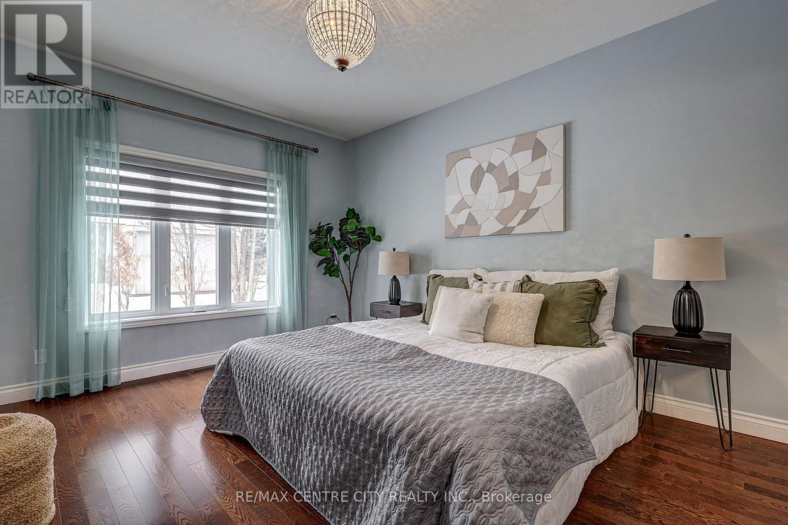 Primary Bedroom with Walk in Closet and Ensuite - 101 - 5 Woodhaven Drive, Tillsonburg, ON - Indoor Photo Showing Bedroom
