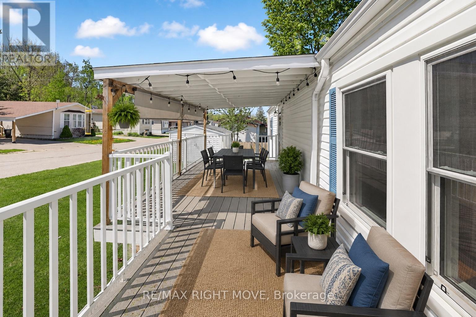 Covered Porch w/8ft Privacy Blind Virtually Staged - 4041 Ash Crescent, Severn, ON