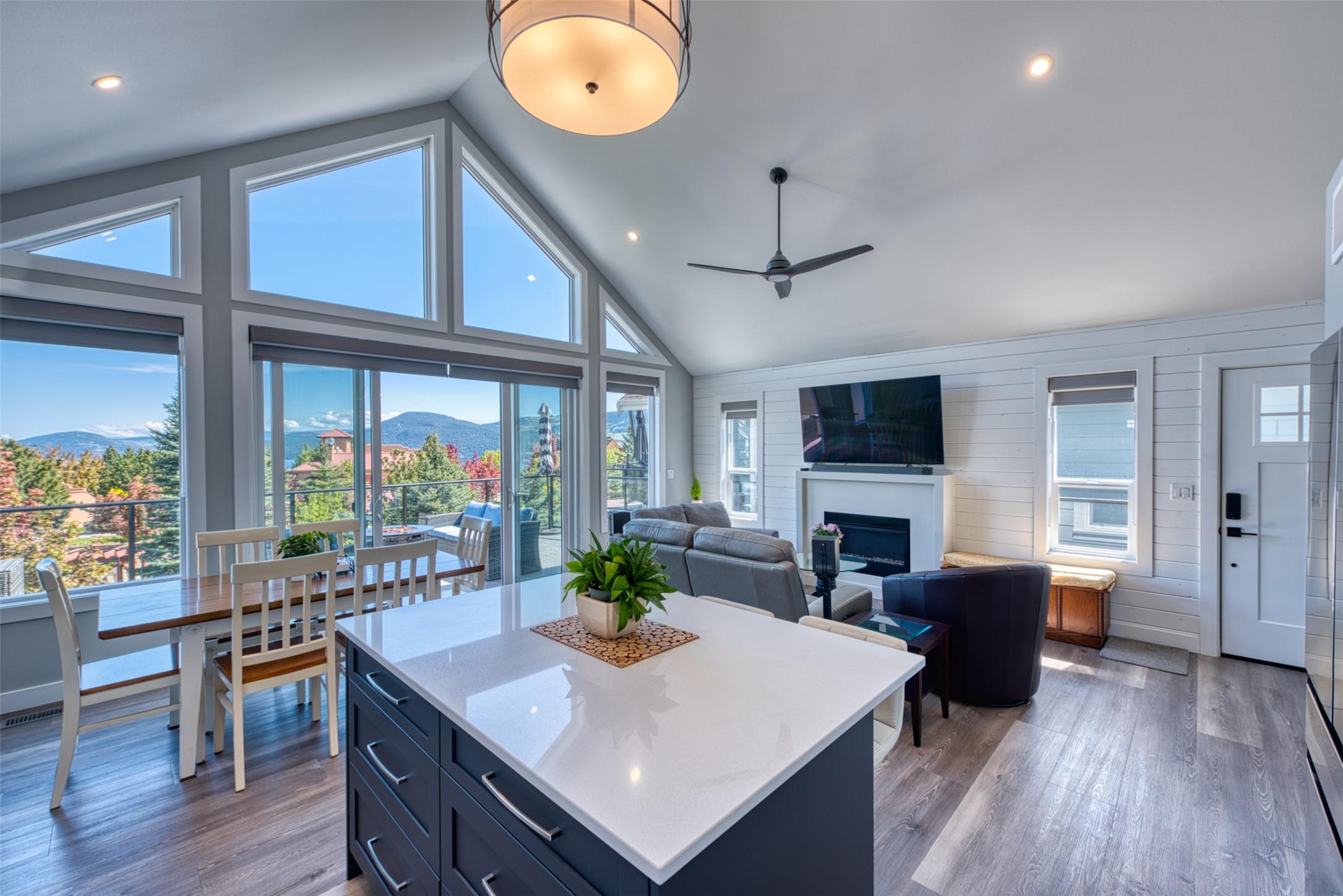 348-6833 Madrid Way, Kelowna, BC - Indoor Photo Showing Dining Room With Fireplace