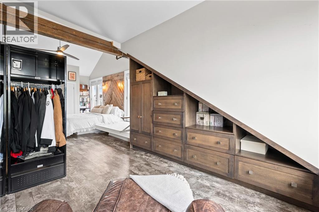 Bedroom featuring lofted ceiling with beams, ceiling fan, and a closet - 25 Concession Street Unit# 201, Cambridge, ON - Indoor