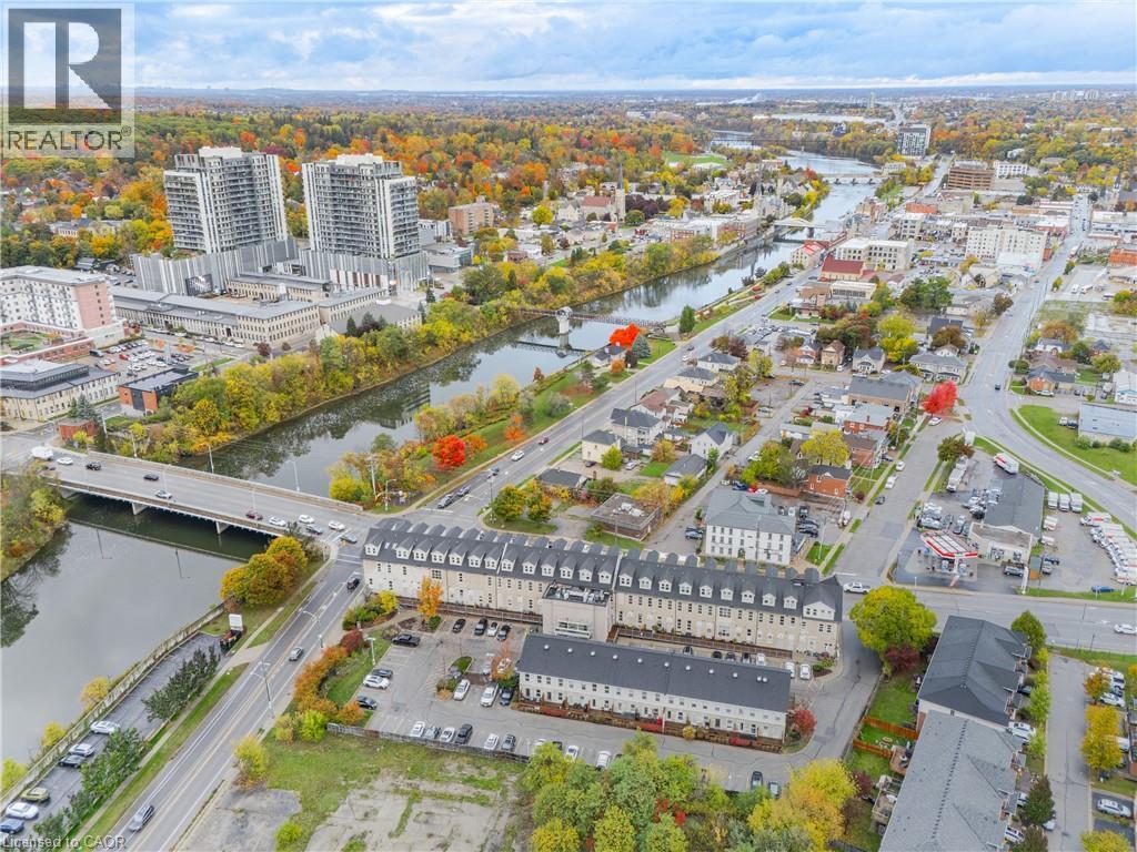 View of urban area featuring a large body of water and a notable bridge - 25 Concession Street Unit# 201, Cambridge, ON - Outdoor With View