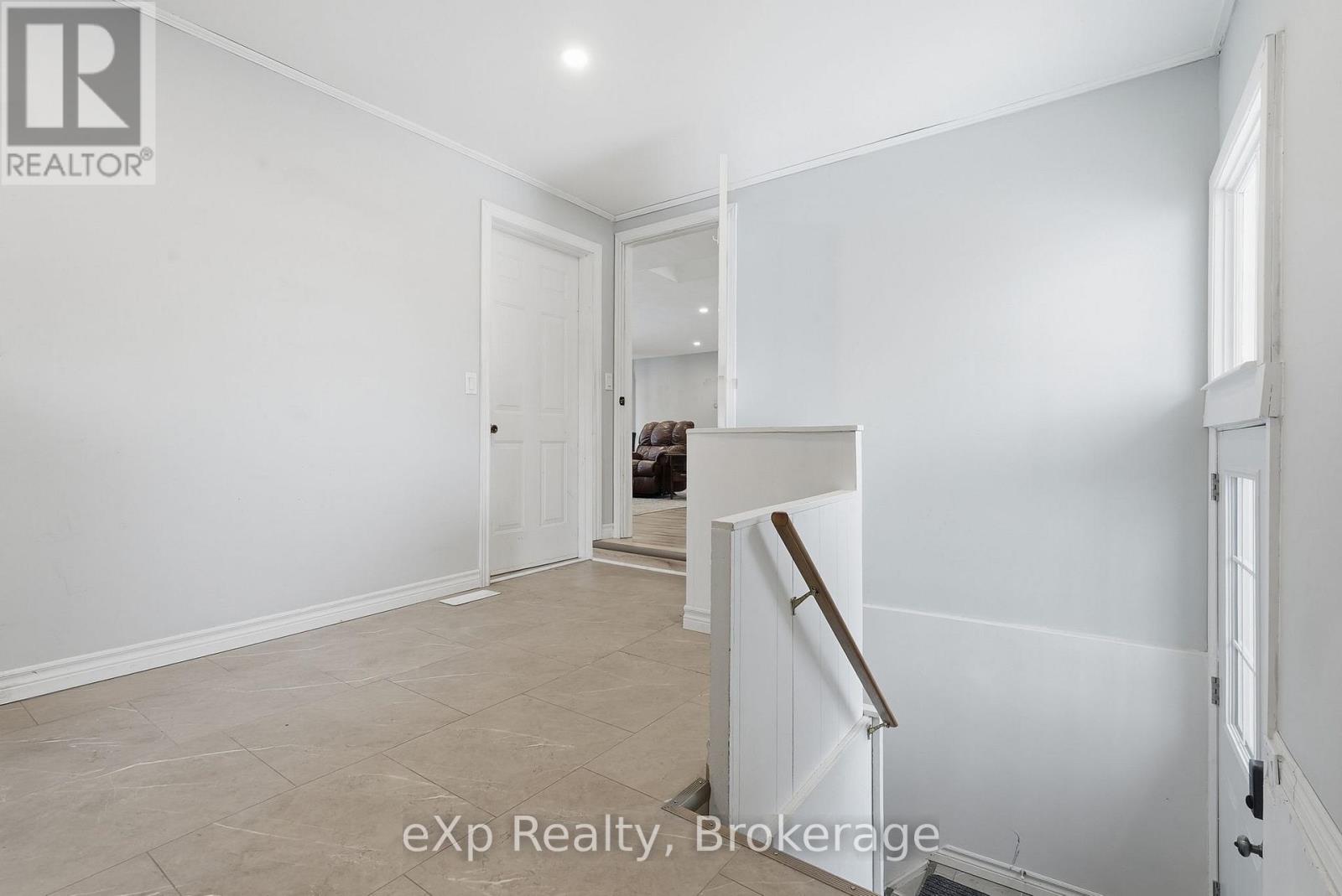 Mudroom/ laundry and basement access - 60 Main Street E, Mapleton, ON - Indoor Photo Showing Other Room
