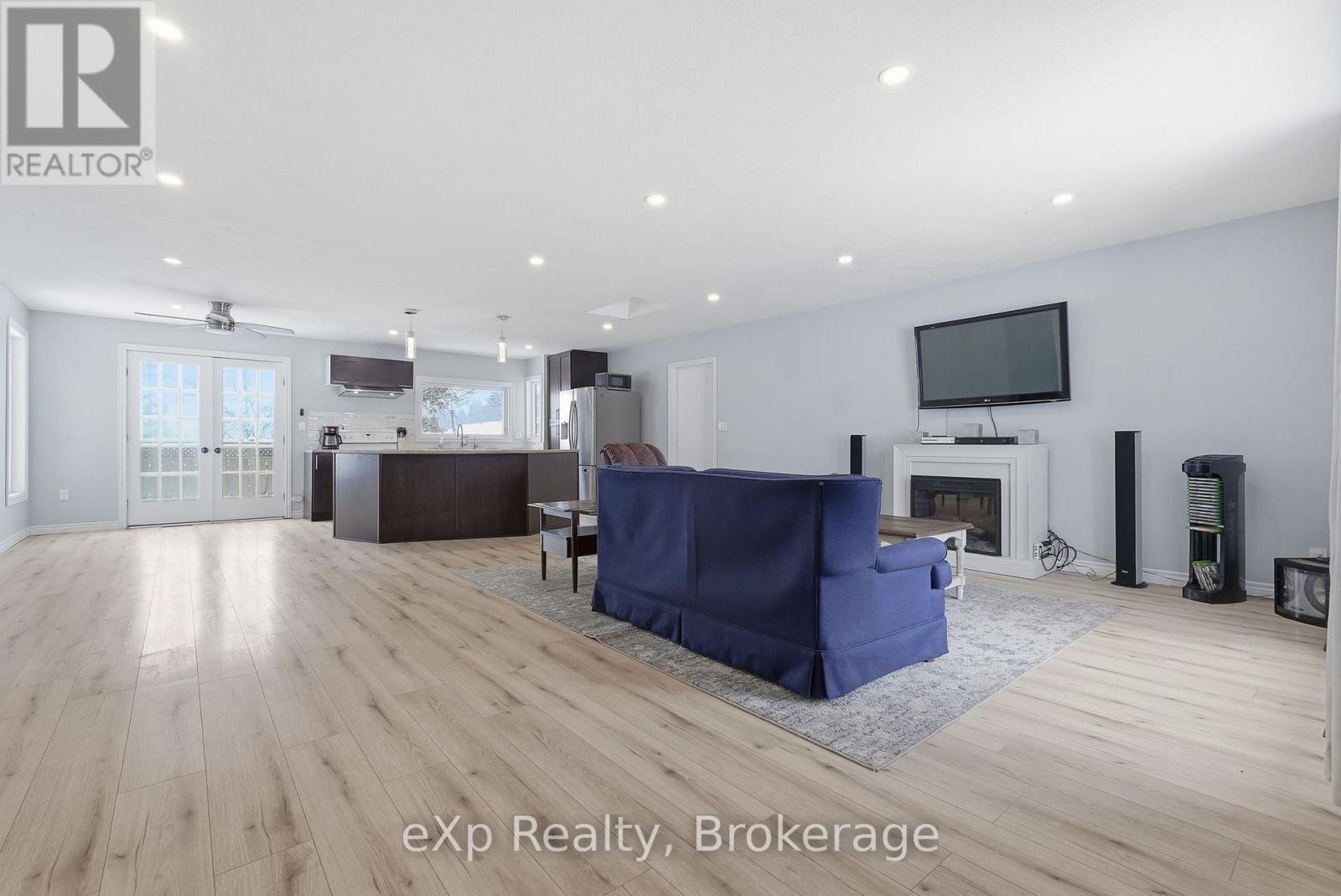 Living room, dining and kitchen - 60 Main Street E, Mapleton, ON - Indoor With Fireplace