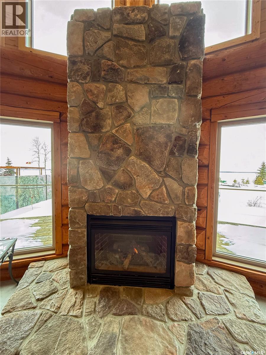 1512 Birch Drive, Turtle Lake, SK - Indoor Photo Showing Living Room With Fireplace