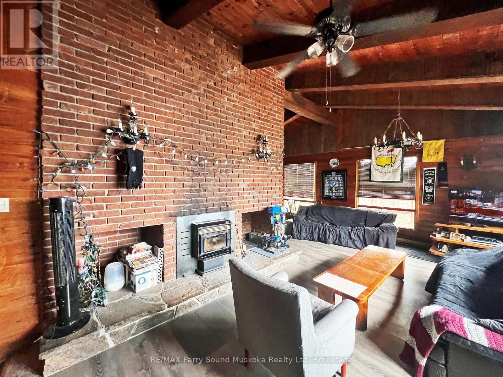 45 Ridgeway Drive, Carling, ON - Indoor Photo Showing Living Room With Fireplace