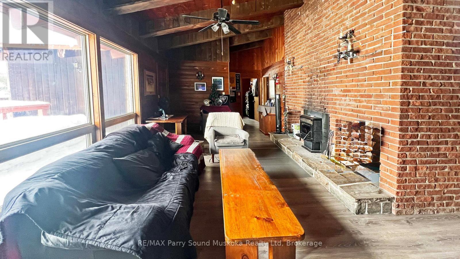 45 Ridgeway Drive, Carling, ON - Indoor With Fireplace