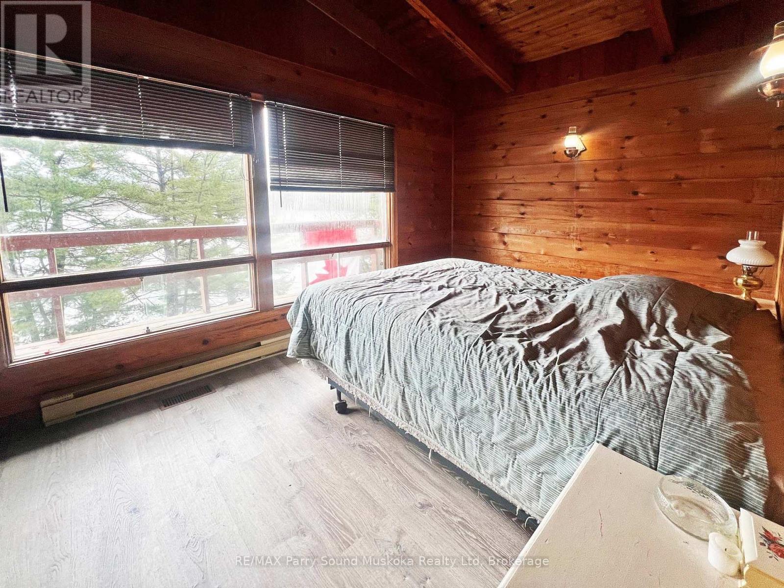 2nd Bedroom with lake views - 45 Ridgeway Drive, Carling, ON - Indoor Photo Showing Bedroom