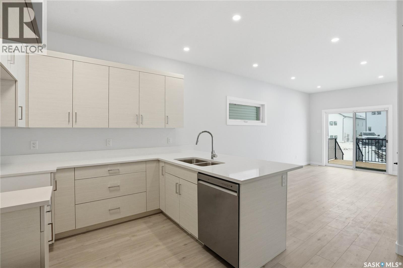 527 Sharma Crescent, Saskatoon, SK - Indoor Photo Showing Kitchen With Double Sink
