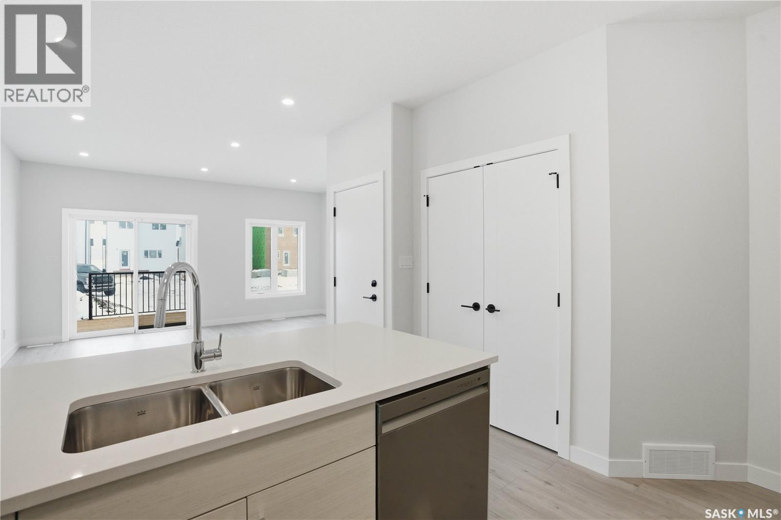 527 Sharma Crescent, Saskatoon, SK - Indoor Photo Showing Kitchen With Double Sink