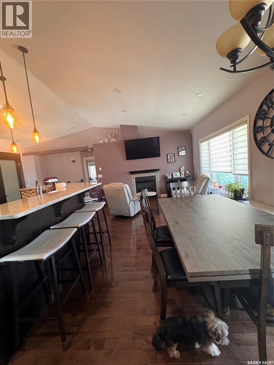1916 Jesse Bay, Estevan, SK - Indoor Photo Showing Dining Room With Fireplace